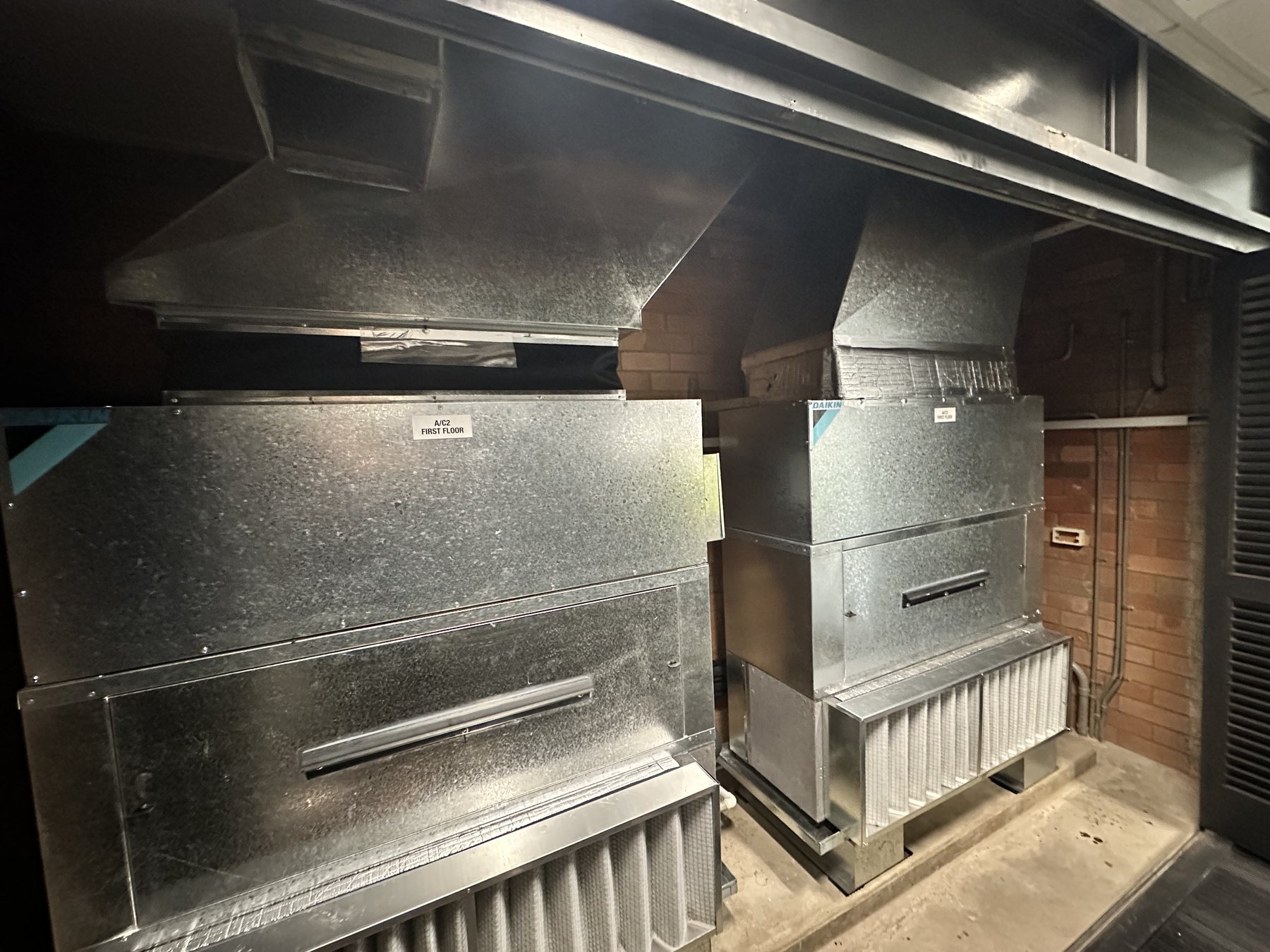 New vertical upright ducted air-conditioning fan coil after installation
