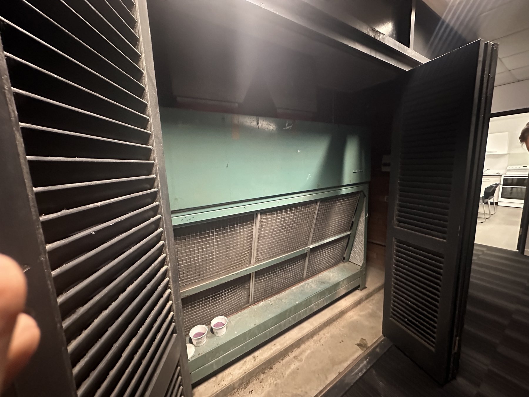 Existing vertical upright ducted air-conditioning fan coil before replacement